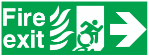 Imagen ficticia representando la señal de salida de emergencias en caso de incendio sustituyendo la figura de una persona corriendo por una persona en silla de rueda